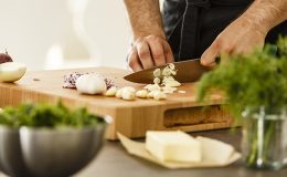 Smelly kitchen hands cutting garlic